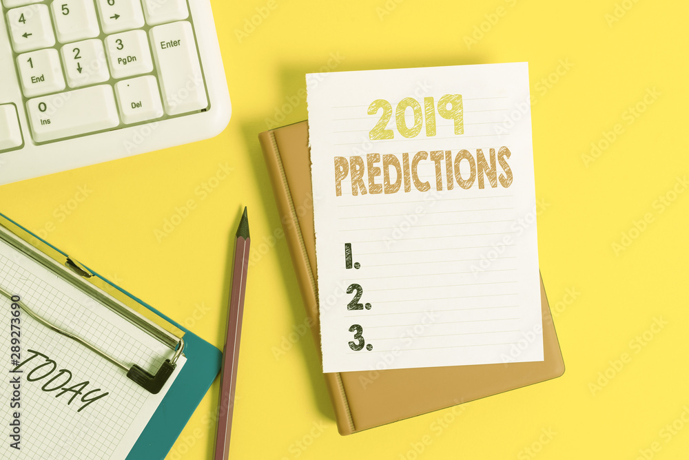 Writing note showing 2019 Predictions. Business concept for statement about what you think will happen in 2019 Pile of empty papers with copy space on the table Writing note showing 2019 Predictions. Business concept for statement about what you think will happen in 2019 Pile of empty papers with copy space on the table