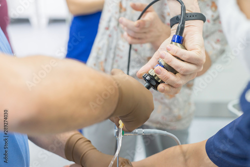 фотографія A team of urologist doctors performing a cystoscopy using a cystoscope