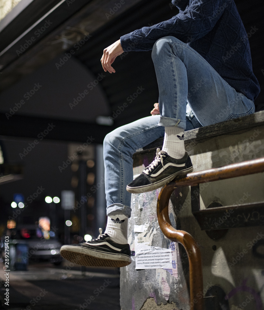 Milan, Italy - November 24, 2018: Young man wearing Vans Old Skool shoes in  the street - illustrative editorial Stock Photo | Adobe Stock