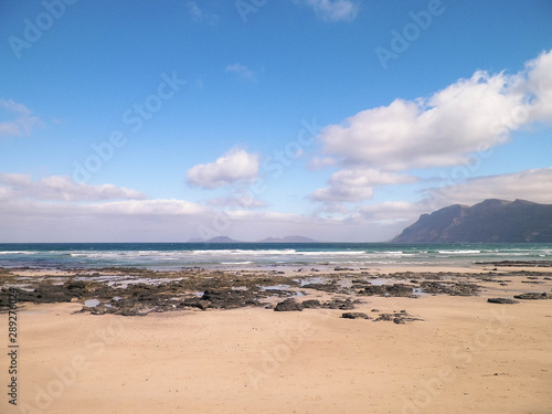 Beach and mountains - beautiful coast in Caleta de Famara  Lanzarote Canary Islands.