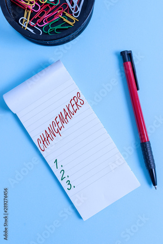 Writing note showing Changemakers. Business concept for Young Turk Influencers Acitivists Urbanization Fashion Gen X Notebook and stationary with mouse above pastel backdrop photo