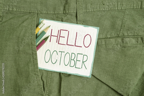 Handwriting text Hello October. Conceptual photo Last Quarter Tenth Month 30days Season Greeting Writing equipment and white note paper inside pocket of man work trousers