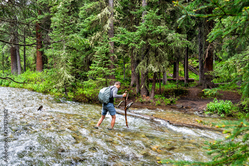 Εκτύπωση καμβά Man crossing river strong current ford on Conundrum Creek Trail in Aspen, Colora