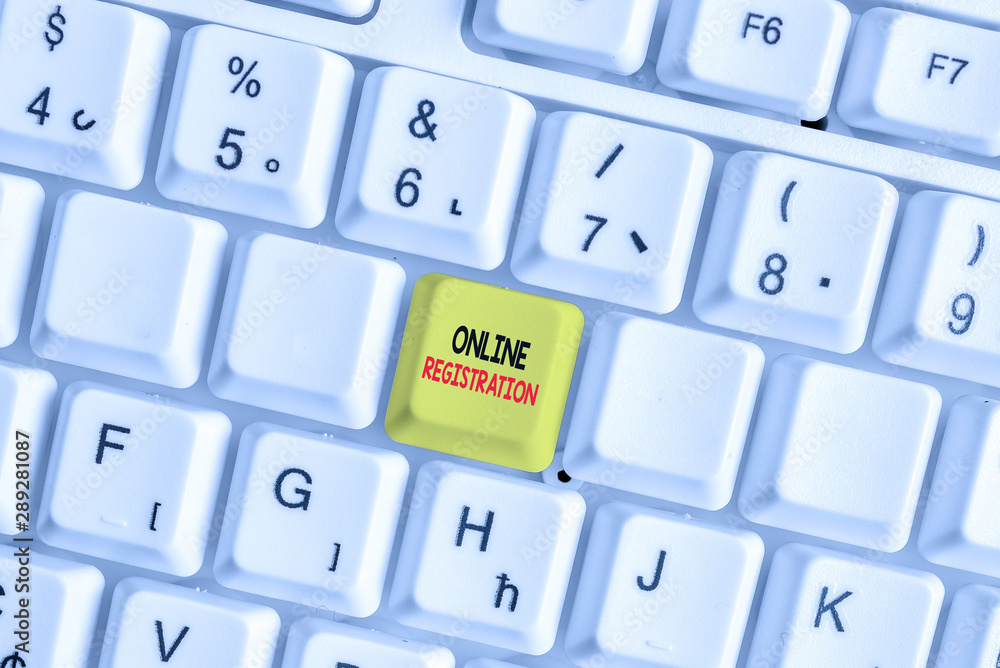 Writing note showing Online Registration. Business concept for System for subscribing or registering via the Internet White pc keyboard with note paper above the white background Writing note showing Online Registration. Business concept for System for subscribing or registering via the Internet White pc keyboard with note paper above the white background