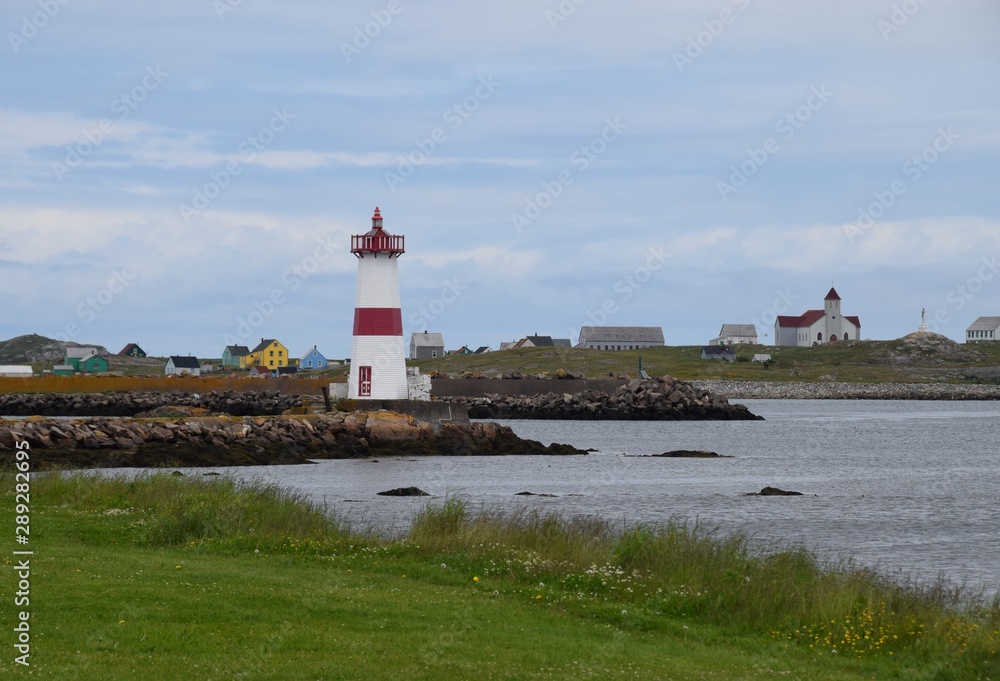 lighthouse  at Point aux Canons on Saint Pierre island, Ile aux Marion in the background  Saint Pierre and Miquelon