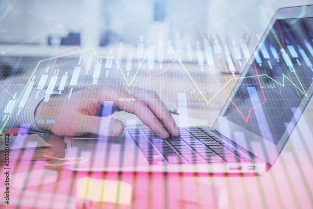 Double exposure of stock market graph with man working on laptop on background. Concept of financial analysis. Double exposure of stock market graph with man working on laptop on background. Concept of financial analysis.