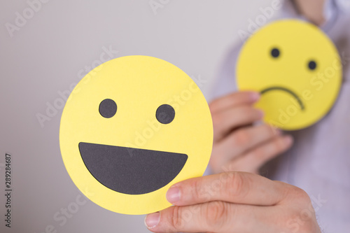 Hand is selecting a happy m...