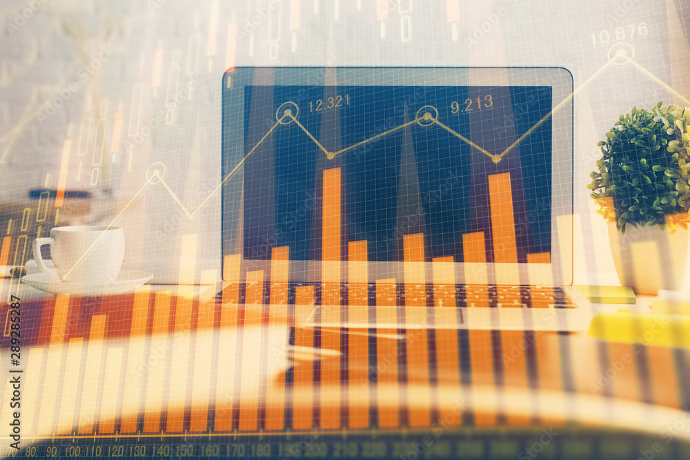 Multi exposure of forex graph and work space with computer. Concept of international online trading. Multi exposure of forex graph and work space with computer. Concept of international online trading.