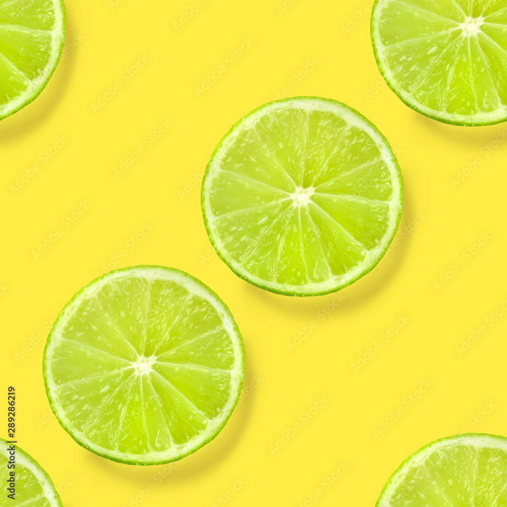 A seamless lime pattern on a vibrant yellow background, a juicy fruity citrus repeat print