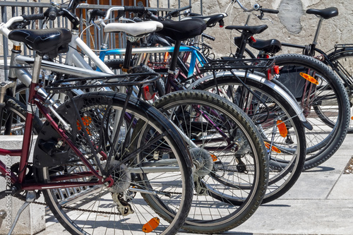 Bicycles parked in a row in a bicycle parking lot