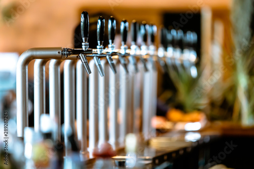 Row of beer taps in a pub