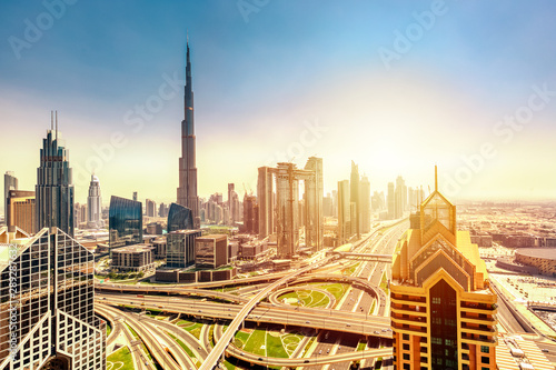 Amazing skyline cityscape with modern skyscrapers. Downtown of Dubai at sunny day during sunrise, United Arab Emirates.