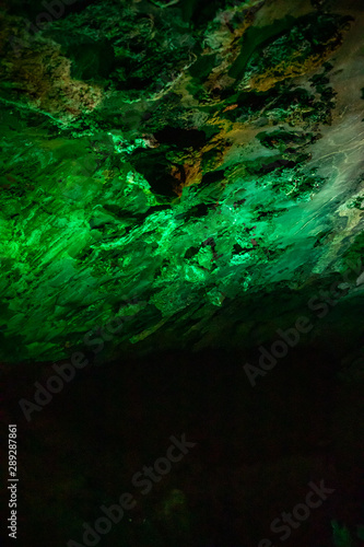 Beautiful illuminated multicolored stalactites in Danzhou Stone Flower Caves  Geopark next to Haikou  Hainan  China