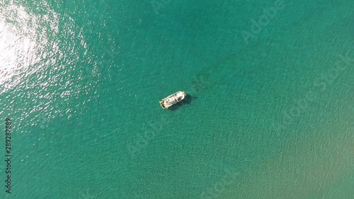 Aerial zenith view of a Shrimp boat in the Mediterranean, in front of the coast of Malaga. Picking the typical 