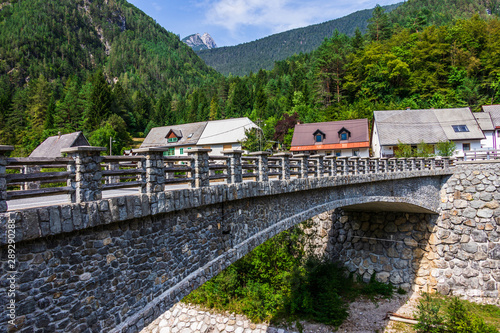 Bridge over River Predelica from Predil Pass in Village Log pod Mangartom. Bovec, Slovenia, Europe.