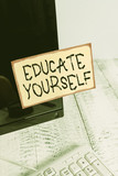 Word writing text Educate Yourself. Business photo showcasing prepare oneself or someone in a particular area or subject Notation paper taped to black computer monitor screen near white keyboard