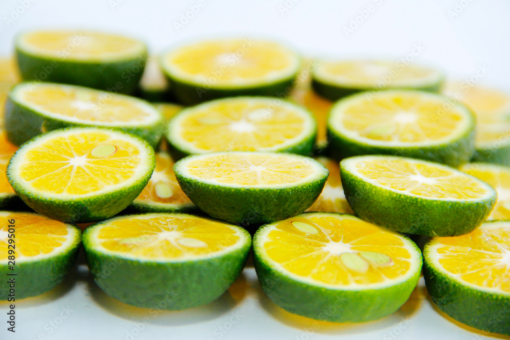 round slices of natural fresh tangerines, oranges, lemon, lime with green peel round slices of natural fresh tangerines, oranges, lemon, lime with green peel