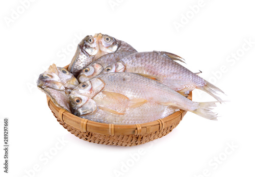 dried (one-sun) marinated butterfly silver barb in bamboo basket with white background
