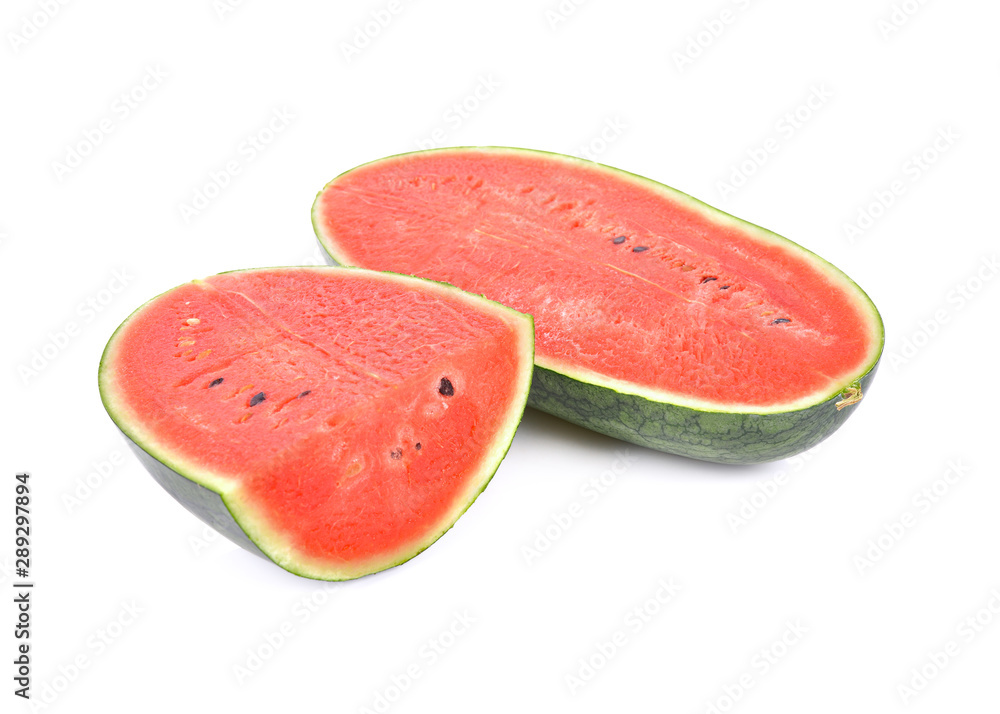 half and portion cut watermelon with seeds on white background