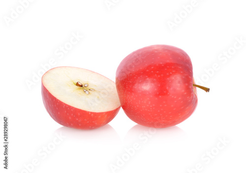 whole and half cut fresh pink lady apple with stem on white background
