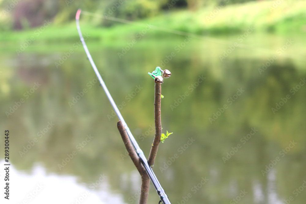 Fishing with feeder fishing rod on river, view from place of fisherman during fishing Fishing with feeder fishing rod on river, view from place of fisherman during fishing