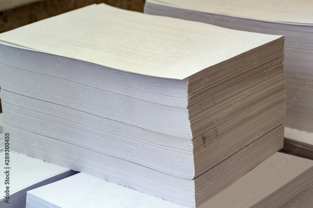 Printed sheets of paper folded (after printing). View from the corner of the pack Printed sheets of paper folded (after printing). View from the corner of the pack