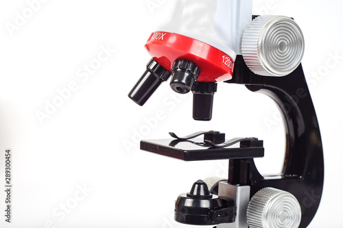 Red Microscope ,science tool on white background.
