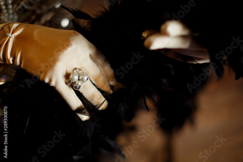 ring decorated with pearls on a gloved hand