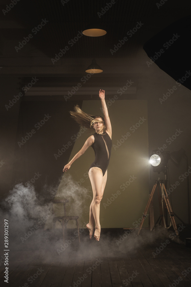 .Dancer, gymnast in a beautiful studio light