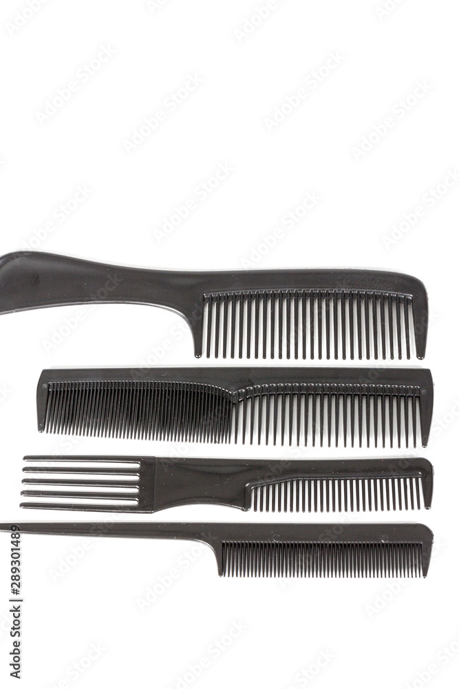 hair tools, beauty and hairdressing concept - different combs on white background hair tools, beauty and hairdressing concept - different combs on white background
