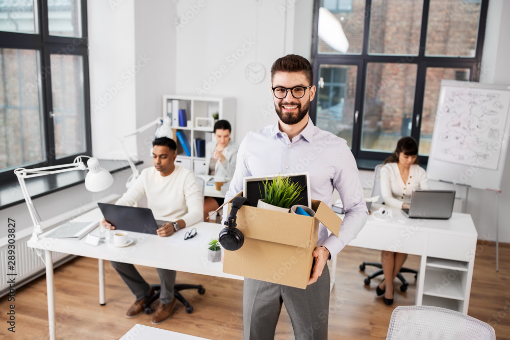 Fototapeta premium business, new job and quit concept - happy smiling male office worker with personal stuff