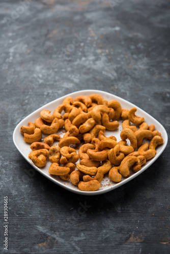 Masala Kaju or spicy Cashew in a bowl. Popular festival snack from India/asia, also known as Chakna recipe