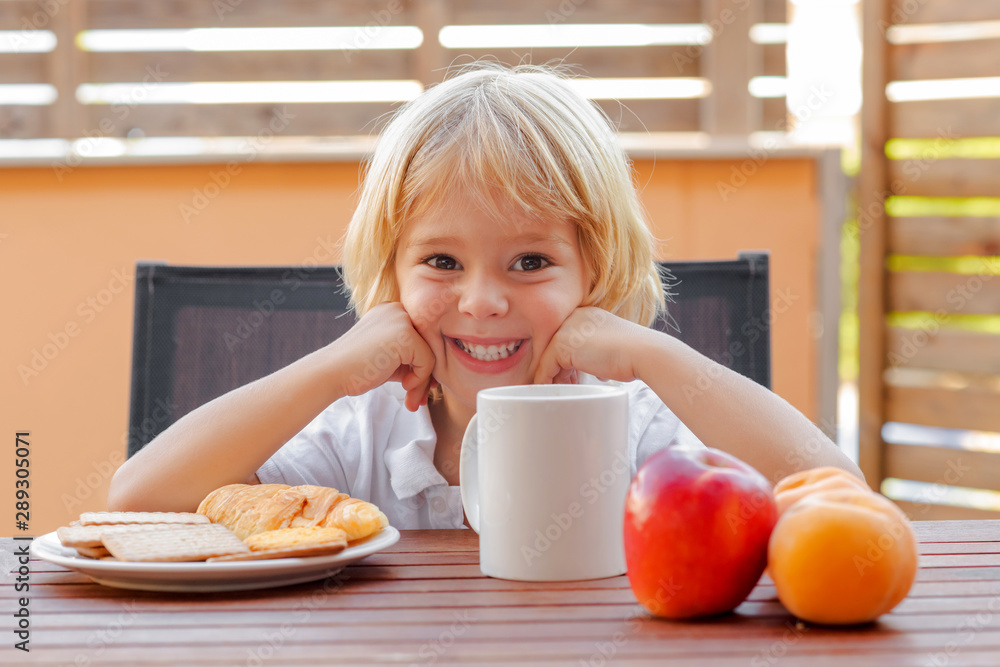 Child with breakfast or snack smiling Child with breakfast or snack smiling