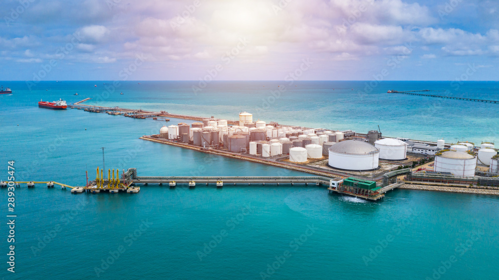 Aerial view white storage tank of oil and gas and petrochemical products ready for logistic and transport business. Aerial view white storage tank of oil and gas and petrochemical products ready for logistic and transport business.