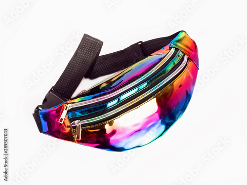 Waist bag with strap on a white background. Belt bag in rainbow color.Multi-colored trendy handbag for girls.