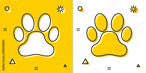 Black Paw print icon isolated on yellow and white background. Dog or cat paw print. Animal track. Random dynamic shapes. Vector Illustration