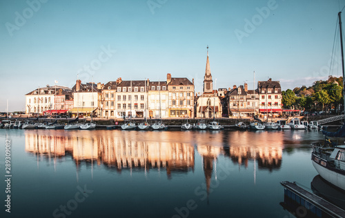 HONFLEUR, FRANCE - MAY4, 2018:Waterfront reflection of traditional houses in Honfleur, Normandy, France © Melinda Nagy