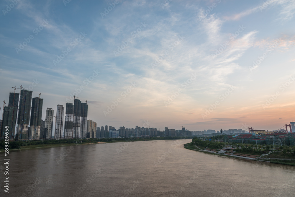 Skyline Landscape of River and Riverbank Architecture in Asian Cities at Dusk