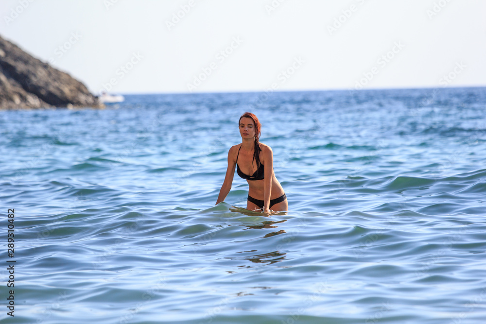Beautiful Sexy Young Woman swimming