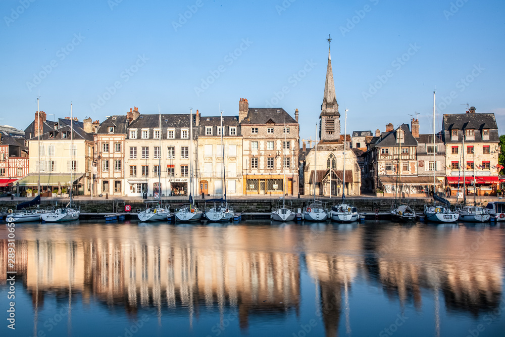 HONFLEUR, FRANCE - MAY4, 2018:Waterfront reflection of traditional houses in Honfleur, Normandy, France