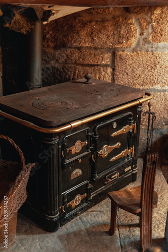  An old wood stove placed in a corner of a house