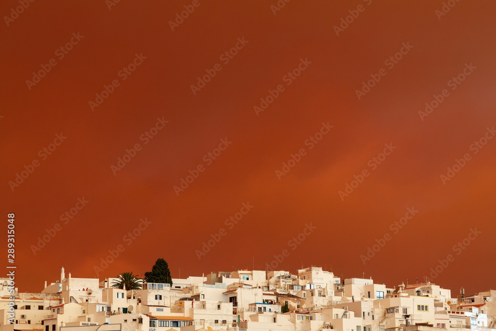 Red Sky. Sky with reflection of fire. Portugal, Albufeira. Unusual photos of the city.