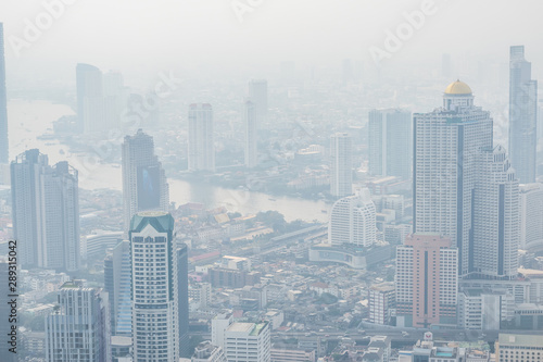 Air pollution in Bangkok with PM2.5 air-quality index  AQI  reached dangerous level with dust and smog in hazy sky  threatening to public health  rooftop view