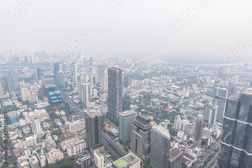 Air pollution in Bangkok with PM2.5 air-quality index  AQI  reached dangerous level with dust and smog in hazy sky  threatening to public health  rooftop view