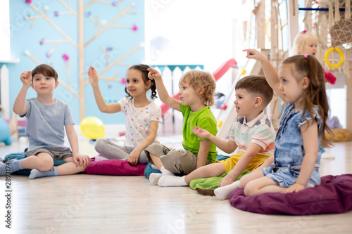 Photos Preschool children play on speech therapy lesson in kindergarten or primary scho