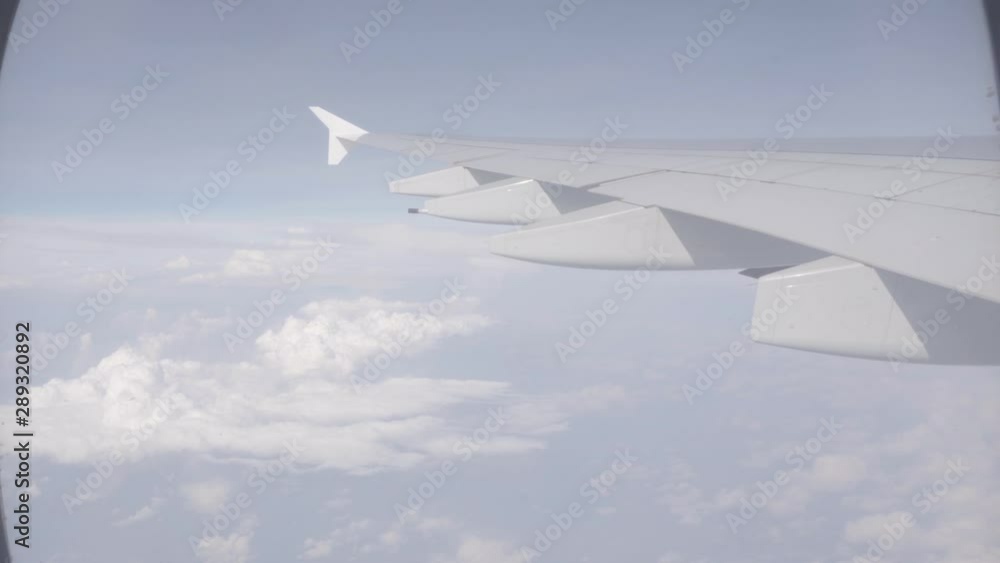 POV video of opening up a window on a plane and looking out POV video of opening up a window on a plane and looking out