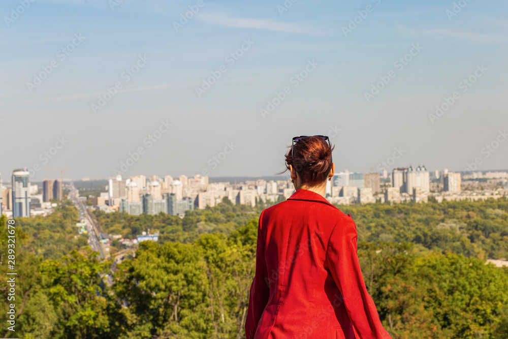 Woman looking at the Kiev city