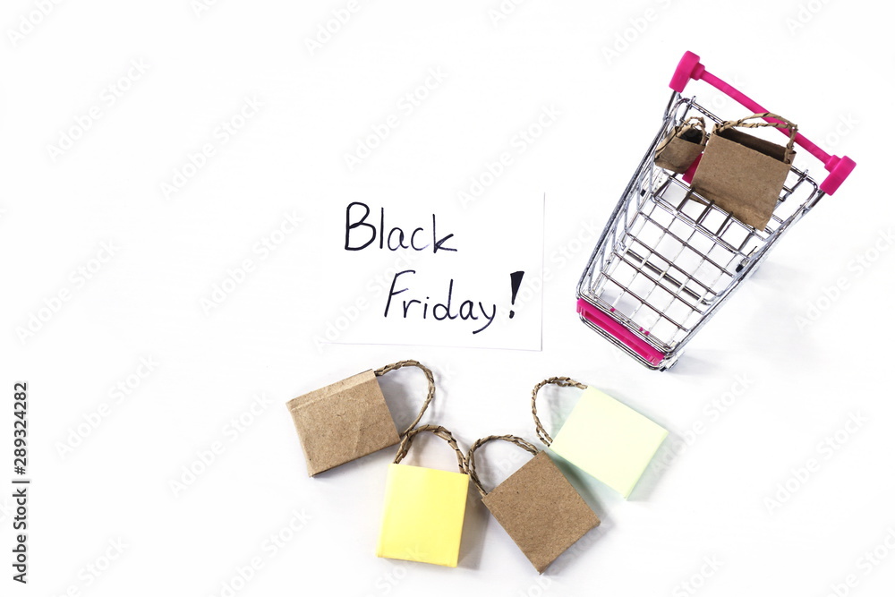 Fototapeta premium shopping cart and shopping bags on white background black friday sale shopping