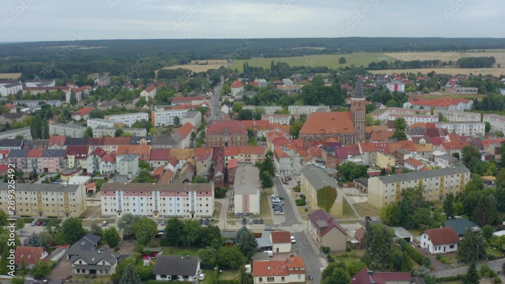 Aerial view of the city Calau in east germany on a cloudy day in summer. Descending beside the city. Aerial view of the city Calau in east germany on a cloudy day in summer. Descending beside the city.