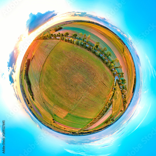 Beautiful 360 panoramic little planet aerial drone view to Bialowieza Forest - one of the last and largest remaining parts of the immense primeval forest that once stretched across the European Plain photo